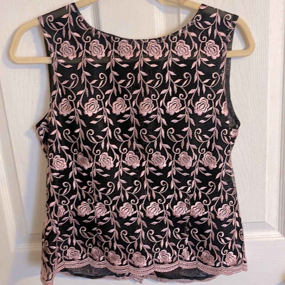 Beautiful, handmade, sleeveless lace shirt. Fits a size medium.